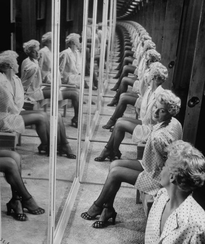 Shelley Winters in a booth with mirrors, 1949