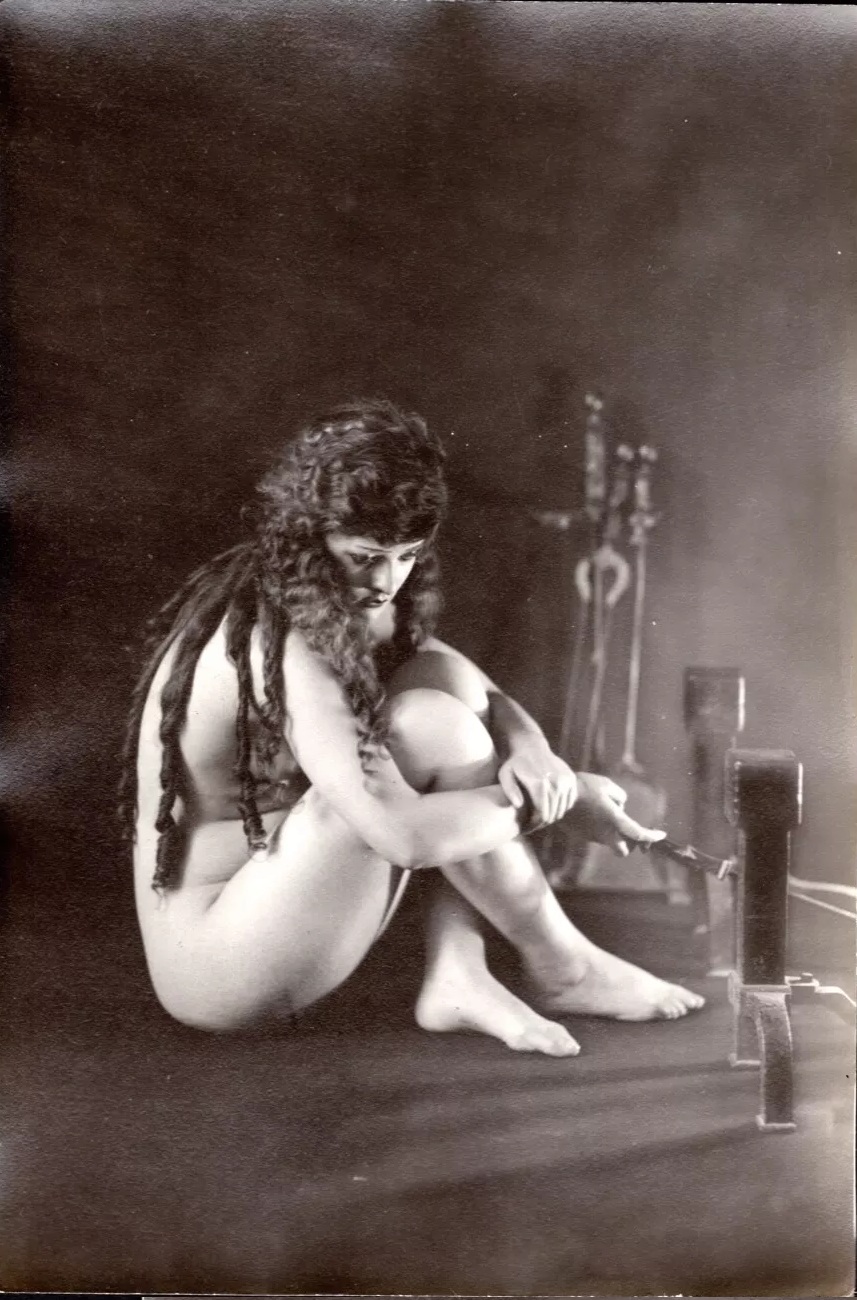 1916 Albert Arthur Allen. Woman by the fireplace b